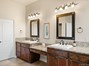 Large granite vanity with dual sinks.