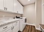 laundry and mud room with granite counters