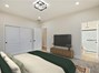 Primary Bedroom. Furniture virtual staged to show possible placement.