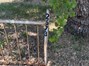 Road Marker on Wrought Iron "fence"