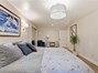 Downstairs bedroom with custom lighting