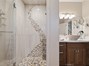 Shower tile matches pool matif