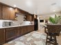 Downstairs kitchen that has an ice maker, refrigerator and dishwasher!