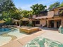 Looking to this beautiful home from outdoor sitting