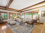 Living room with original and updated custom woodworking