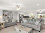 Open concept living room into dining & kitchen
