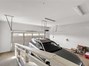 garage interior showing ramp up to door