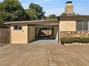 Entrance to garage area with automatic garage door opener