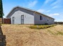 Rear of home and side yard.