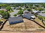 Rear of home backyard overview.