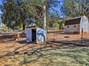 designated area for chickens with the cutest coop ever! property fenced and cross fenced. goat yard with shelter