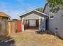 Pass through garage provides easy access to the backyard.