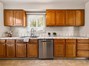 Traditional wood cabinetry offers plenty of storage for your everyday essentials.