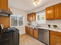 A cozy kitchen ready for home-cooked meals, featuring stainless steel appliances.