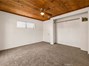 A bedroom retreat with charming wood ceilings and sliding glass doors to your own private deck!