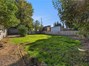 Imagine the possibilities in this oversized backyard! Gardening, entertaining, or simply relaxing beneath the shade trees. There's room to make it your own!