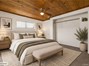 Virtually staged to inspire your vision of a cozy bedroom retreat with charming wood ceilings!