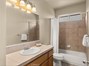 Guest bath with tub/shower combo.