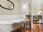 Primary bath with a new claw foot soaking tub.