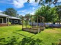 Front yard with two large garden beds ready for crops