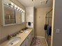 primary 3/4 bath with double vanity