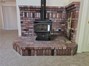 woodstove on brick hearth