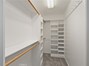 Primary bedroom walk in closet