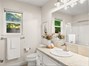 Guest bath with tub/shower combo.