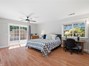 Primary Bedroom has 2 sliding glass doors to backyard