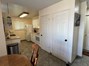 Dining area featuring a textured ceiling and light tile patterned floors