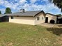 View of side of home with a patio area and stucco siding