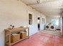 Virtually staged sun room with laundry space