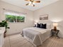 3rd bedroom with window view of the backyard