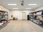 Fully finished garage with sink, on demand water heater and tons of shelving