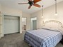 Primary suite with ceiling fan and over bed reading lights