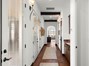Hallway with double doors leading to courtyard.