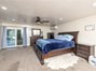 Master Bedroom with private patio access & front entry.