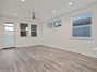 Main House Entry + Living Area. Photo taken prior to tenant occupancy