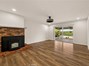Family room with pellet stove and access to backyard