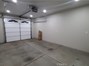 Finished garage with automatic door.