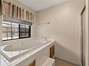 Master bathroom with large tub