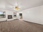 Family room with fireplace connected to the kitchen
