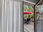 door to hot tub and deck from bedroom