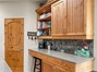 Beautiful Kitchen Overlooking the Canyon w/ Custom Cabinetry with Pull Out Shelves and Soft Closed Drawers. Lots of Storage with Walk-In Pantry
