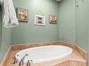 Primary Bathroom with Dual Vanities, Soaking Tub and Tiled Walk-In Shower.
