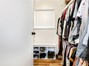 1/2 of Walk-In Closet with organizers