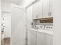 Hallway holds the Washer/Dryer with tons of cabinet space!
