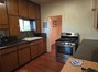 Kitchen has gas range & portable dishwasher