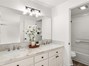 Dual vanity sink and tub shower combo in primary.