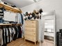 Primary bedroom walk-in closet